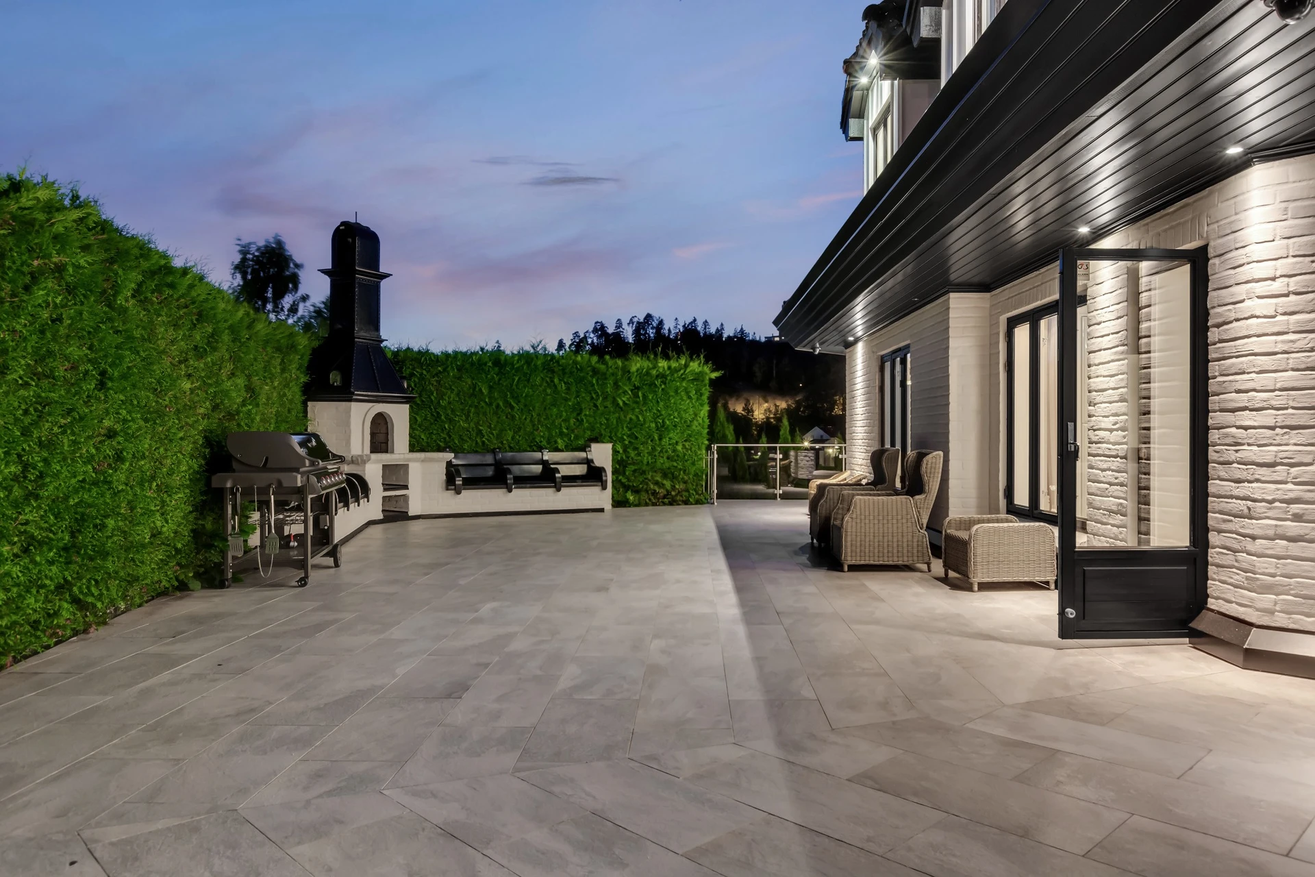 Outdoor BBQ and entertainment terrace with water views